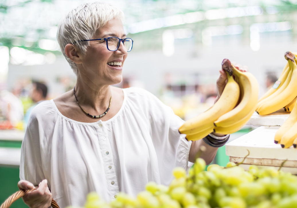 Buying bananas in a market