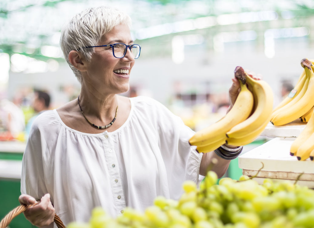 Buying bananas in a market