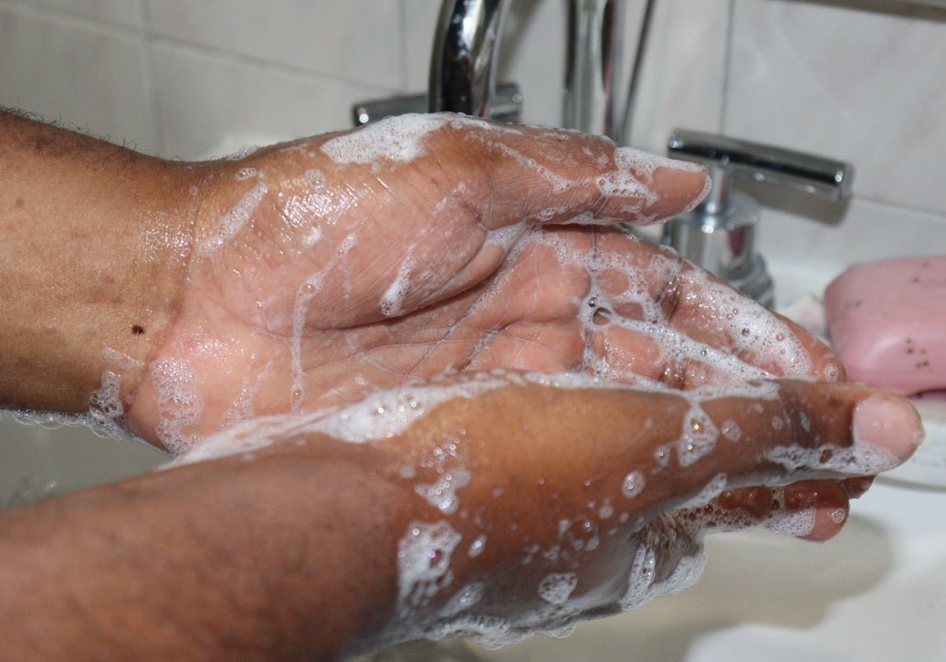washing hands under a tap