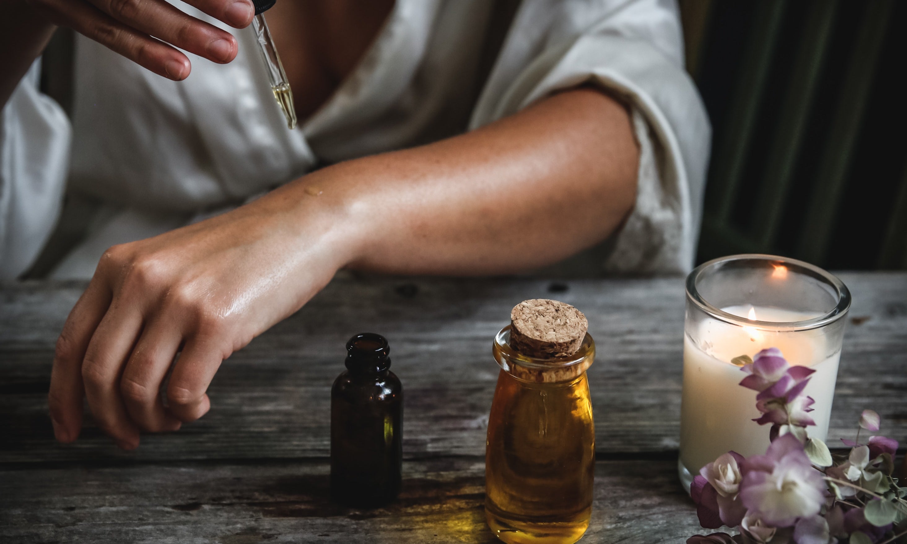 Woman applying rosehip oil