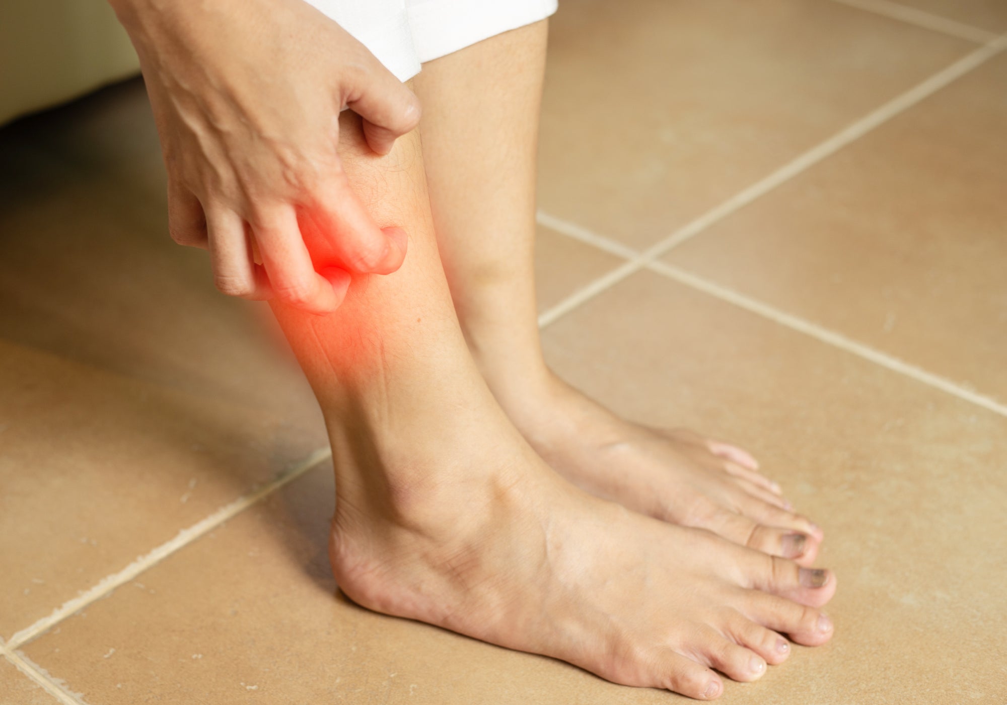 scratching lower leg
