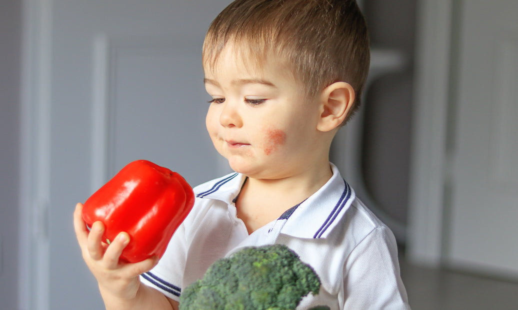 child holding food