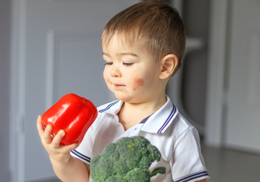 child holding food