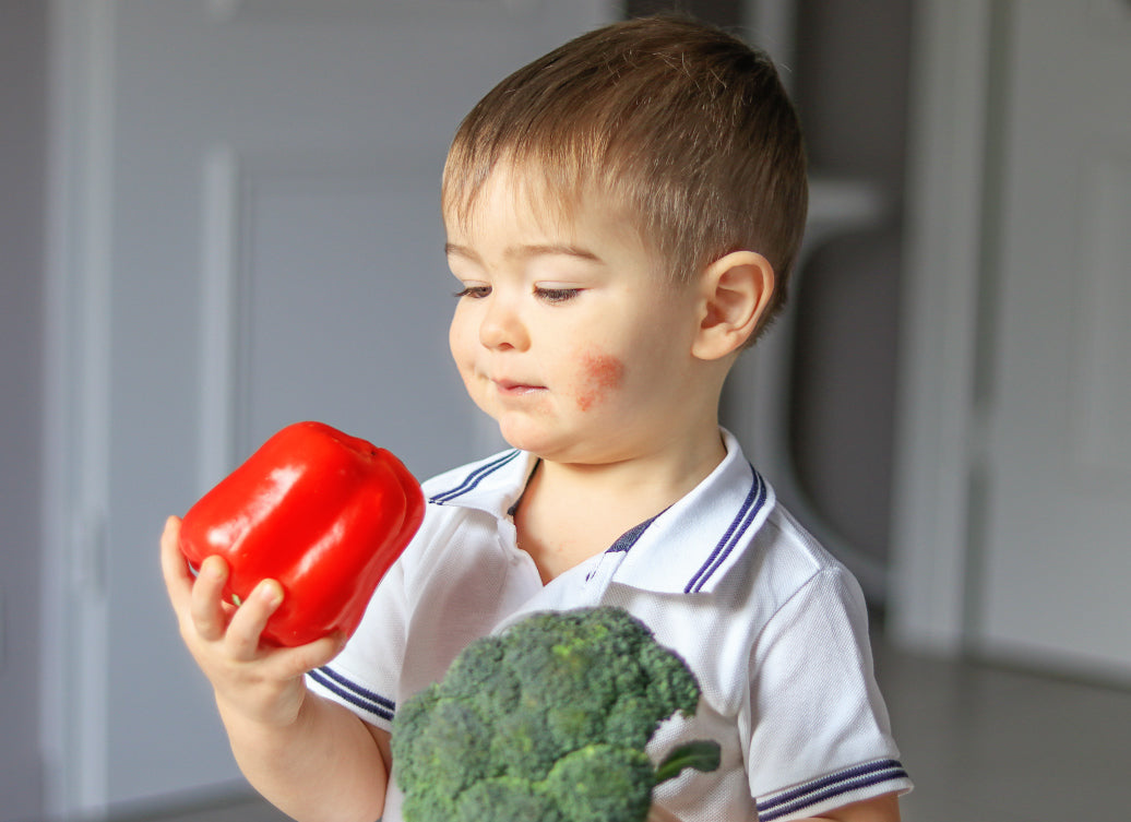 child holding food